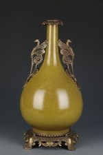 A Tea-Dust Glazed Porclain Vase with Bronze Accents picture
