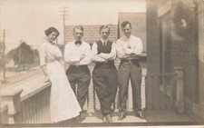 WOMAN WITH 3 MEN SIBLINGS ON FROM PORCH PORTRAIT REAL PHOTO POSTCARD 1910 RPPC picture