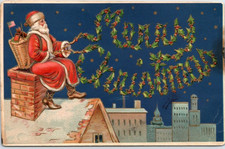 Santa Claus on Snowy Roof Over City with Flag~ Patriotic Christmas Postcard~s491 picture