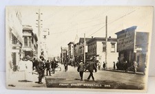 RPPC Marshfield Oregon Front Street Businesses Signs People Wagon 1911 Posted picture