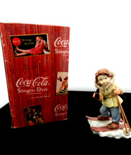 Enesco Coca Cola Girl Figurine Wearing Skis from Simpler Days picture