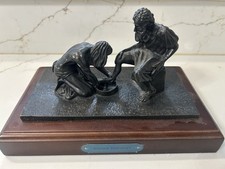 Bronze statue of Jesus washing the feet of Peter, at the last Supper picture