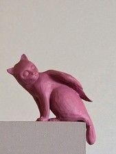 Aritzia Angel Cat pink/mauve color has a long tail/ sitting model picture