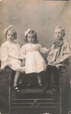 VINTAGE RPPC REAL PHOTO POSTCARD 3 BEAUTIFUL CHILDREN ON CHAIR c1910 090124 T picture