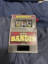 Radica Jackpot Bandit Slot Machine Bank Model 130 • 1990s Vintage Coin Bank picture